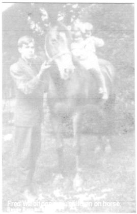 Fred Walbridge with children on horse.