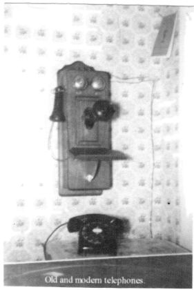 Old and modern telephones (wall type, 1920's and '30s).
