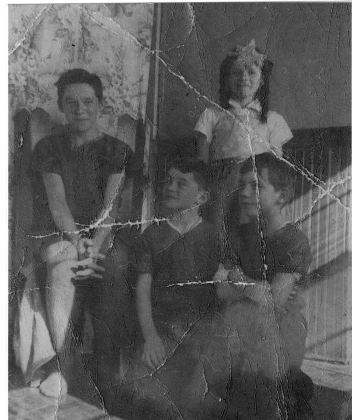 Back, Larry Brown, Grade 8, age 14; Evelyn Brown, Grade 4, age 10; front, Charles Sargent, grade 5, age 11; Carroll Bashaw, grade 5, age 11. About 1948.…