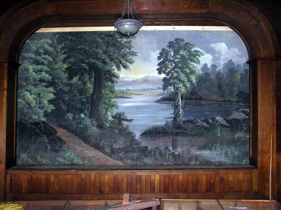 The restored nineteenth-century stage curtain in the Society's museum
